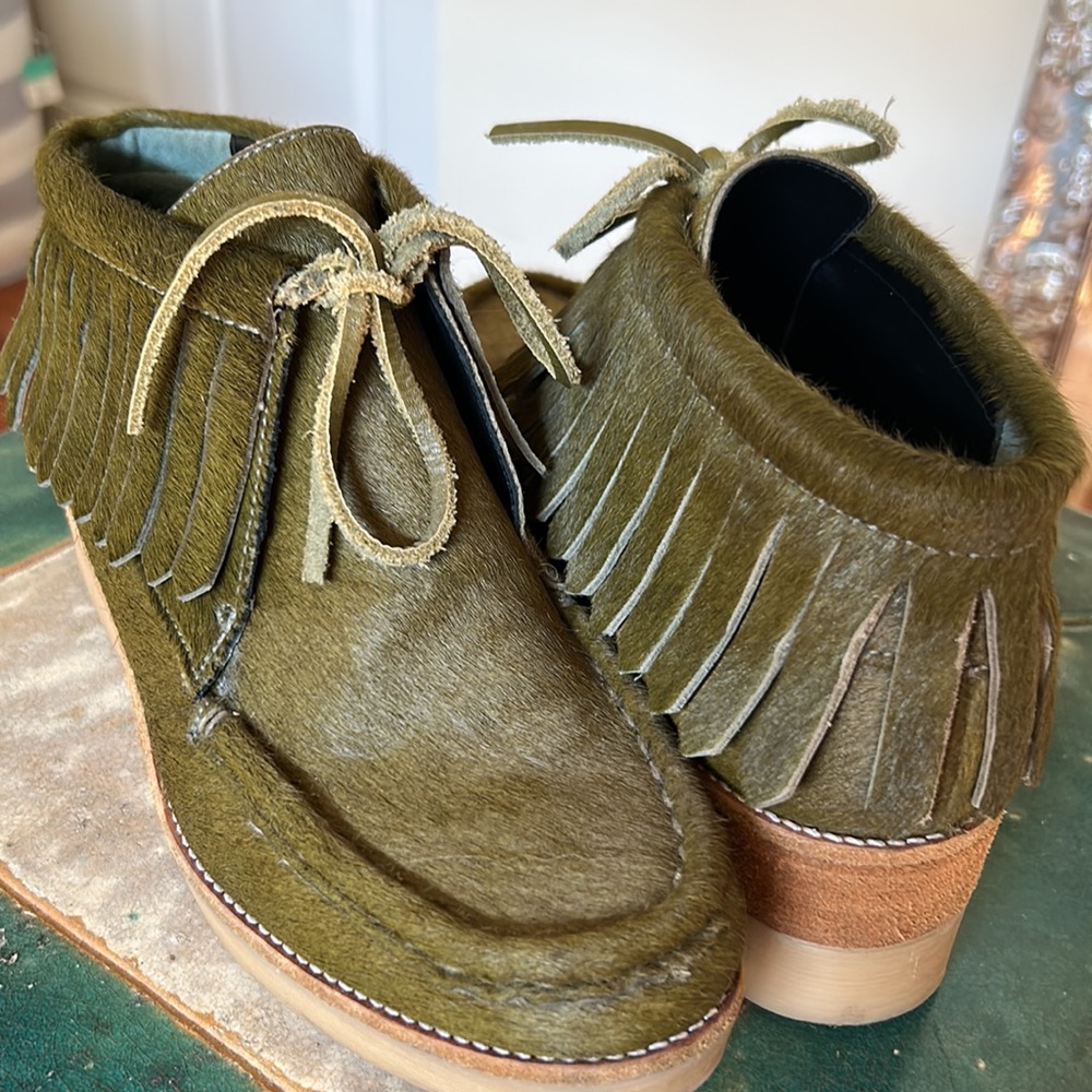 Fringed calf hair bootie by 10 CROSBY DEREK LAM. Rich olive green lace up, wedge